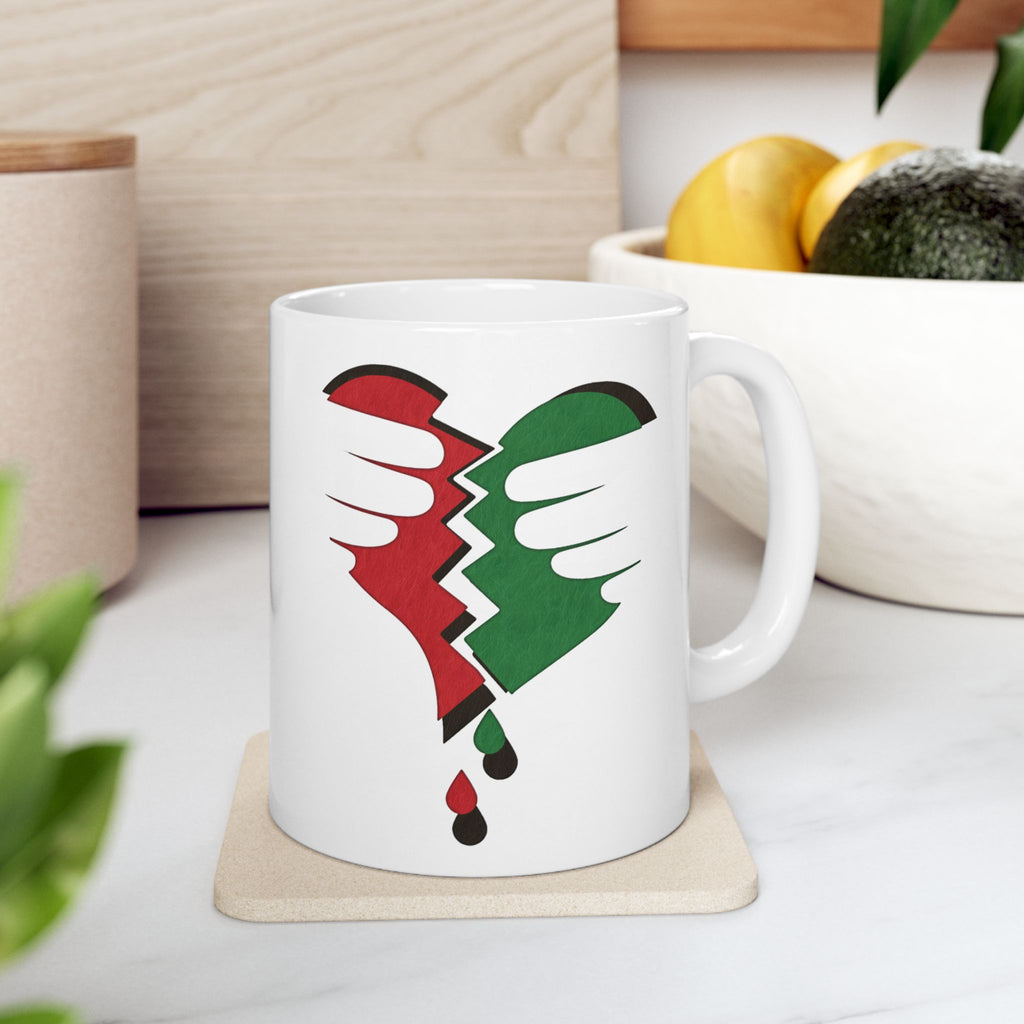 Broken Heart Palestine ceramic mug with vivid shattered-heart design, symbolizing solidarity; custom 11oz & 15oz.